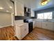 Modern kitchen with white cabinets and quartz countertops at 6601 E Exposition Ave, Denver, CO 80224