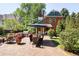 Brick patio with outdoor dining area and a built-in grill at 790 Oneida St, Denver, CO 80220