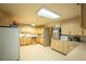 Functional kitchen with wood cabinets and appliances at 461 Tyler Ave, Louisville, CO 80027