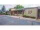 Exterior of Louisville Montessori School and Daycare, featuring signage and landscaping at 461 Tyler Ave, Louisville, CO 80027
