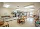 Spacious classroom with multiple tables, chairs, and ample natural light at 461 Tyler Ave, Louisville, CO 80027