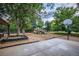 Outdoor playground with playset, basketball hoop, and sandboxes at 461 Tyler Ave, Louisville, CO 80027