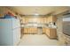Galley kitchen with ample cabinets and appliances at 461 Tyler Ave, Louisville, CO 80027