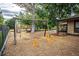 Simple playground with swings and surrounding trees at 461 Tyler Ave, Louisville, CO 80027