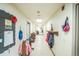 Long hallway with coat hooks and artwork, connecting classrooms at 461 Tyler Ave, Louisville, CO 80027