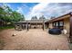 Playground area with swings, play structures, and gravel surface at 461 Tyler Ave, Louisville, CO 80027