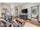 Game room with leather couch, coffee table, and mini fridge at 378 River Park Dr, Breckenridge, CO 80424