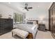 Charming bedroom with a queen-size bed and built-in shelving with a view of the woods at 378 River Park Dr, Breckenridge, CO 80424