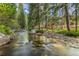 Home nestled along a peaceful river in a wooded area at 378 River Park Dr, Breckenridge, CO 80424