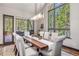 Elegant dining room with a large wooden table and access to a deck at 378 River Park Dr, Breckenridge, CO 80424