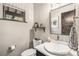 Modern bathroom with white sink, toilet and floating shelves at 378 River Park Dr, Breckenridge, CO 80424