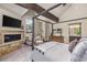 Main bedroom with a four poster bed, fireplace, and sitting area at 378 River Park Dr, Breckenridge, CO 80424