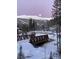 Winter scene with bridge, snow covered landscape and moon at 378 River Park Dr, Breckenridge, CO 80424