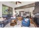 Open living area featuring a living room, kitchen, and dining area with hardwood floors at 378 River Park Dr, Breckenridge, CO 80424