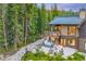 Hot tub and patio with fire pit overlooking the forest at 378 River Park Dr, Breckenridge, CO 80424