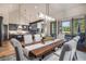 Bright dining room features a large wooden table with seating for eight and views to the mountains at 378 River Park Dr, Breckenridge, CO 80424