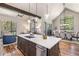 Open concept kitchen with island and views into the dining and living areas at 378 River Park Dr, Breckenridge, CO 80424
