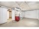 Unfinished basement with utilities and storage area at 2801 W Dartmouth Ave, Denver, CO 80236
