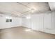 Unfinished basement with high ceilings and large windows at 2801 W Dartmouth Ave, Denver, CO 80236