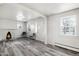 Bright living room featuring a fireplace and gray laminate floors at 2801 W Dartmouth Ave, Denver, CO 80236