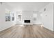 Bright living room featuring hardwood floors and a fireplace at 8848 Whiteclover St, Littleton, CO 80125