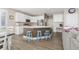 Modern kitchen with white cabinets, a large island, and stainless steel appliances at 1705 Peridot Ct, Castle Rock, CO 80108