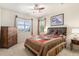 Bright bedroom with hardwood floors and large windows at 6236 Oxford Peak Ln, Castle Rock, CO 80108