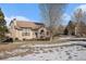 Two-story house with solar panels and a partial view of the backyard at 6236 Oxford Peak Ln, Castle Rock, CO 80108