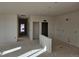 Open hallway showing access to other rooms of the house at 498 Grey Rock St, Brighton, CO 80601