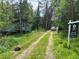 Quaint green cabin nestled in the woods at 106 Brook Rd, Evergreen, CO 80439