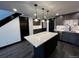 Modern kitchen island with quartz countertop and pendant lighting at 147 Illinois Gulch Rd # 4, Breckenridge, CO 80424