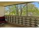 Relaxing balcony with treetop views and seating at 9340 E Center Ave # 2C, Denver, CO 80247