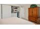 Spacious bedroom with large closet and wood furniture at 9340 E Center Ave # 2C, Denver, CO 80247
