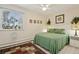 Bedroom with queen bed and window seating at 9340 E Center Ave # 2C, Denver, CO 80247