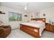 Bright bedroom with king-size bed and ceiling fan at 9340 E Center Ave # 2C, Denver, CO 80247