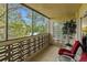 Private balcony with treetop views and seating at 9340 E Center Ave # 2C, Denver, CO 80247