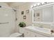 Clean bathroom with white vanity, shower/tub combo, and tile flooring at 9340 E Center Ave # 2C, Denver, CO 80247