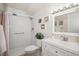 Updated bathroom with white vanity, shower/tub combo, and tile flooring at 9340 E Center Ave # 2C, Denver, CO 80247