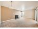 Living room with neutral color walls, carpeted floors and fireplace at 14904 E Hampden Cir # C7, Aurora, CO 80014