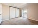 Spacious bedroom with sliding door closet and private balcony at 14904 E Hampden Cir # C7, Aurora, CO 80014