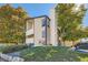Townhouse exterior with landscaping and parking area visible at 14904 E Hampden Cir # C7, Aurora, CO 80014
