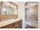 Clean bathroom with a single sink vanity and shower/tub combo at 14904 E Hampden Cir # C7, Aurora, CO 80014