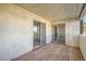 Private balcony with wooden decking and sliding glass doors at 14904 E Hampden Cir # C7, Aurora, CO 80014
