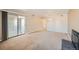 Bright living room with fireplace and access to a private balcony at 14904 E Hampden Cir # C7, Aurora, CO 80014