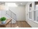 Modern entryway with hardwood floors and staircase at 10860 Lyric St, Lone Tree, CO 80134