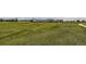 Rolling green golf course with a clubhouse in the background at 2058 S Haleyville Way, Aurora, CO 80018