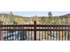 Balcony with wooden railing offering scenic views at 6864 Woodchuck Way, Evergreen, CO 80439