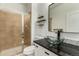 Modern bathroom with glass shower, vessel sink, and marble countertop at 7203 S Ukraine St, Aurora, CO 80016