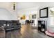 Open living room with hardwood floors and access to kitchen at 7373 E Iowa Ave # 1101, Denver, CO 80231