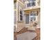Inviting front entrance with gray door and small patio at 7373 E Iowa Ave # 1101, Denver, CO 80231